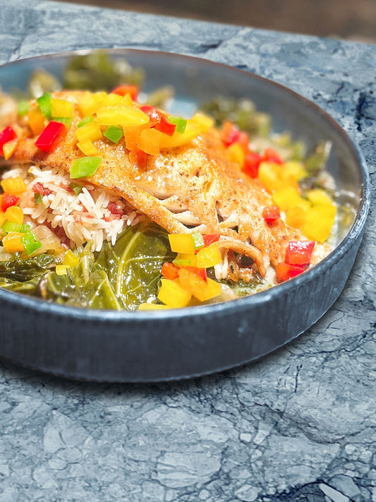 Snapper with Rum Beurre Monte sauce over dirty rice