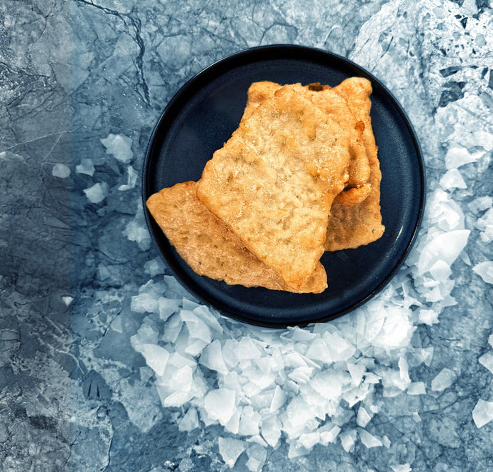 pre-made battered cod fillets on a blue plate